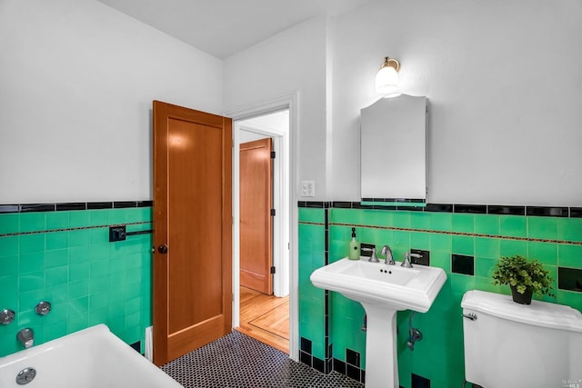 18900 Robinson Rd, Sonoma, CA 95476 - bathroom featuring tile walls, a tub to relax in, and toilet