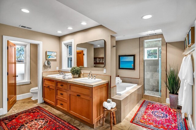 18900 Robinson Rd, Sonoma, CA 95476 - full bathroom with plus walk in shower, toilet, vanity, and tile patterned flooring