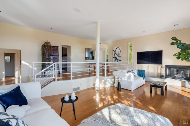 living room with visible vents and wood finished floors