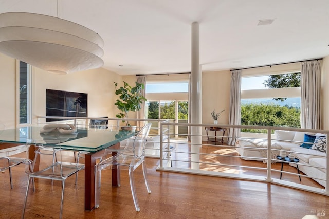 dining area with wood finished floors