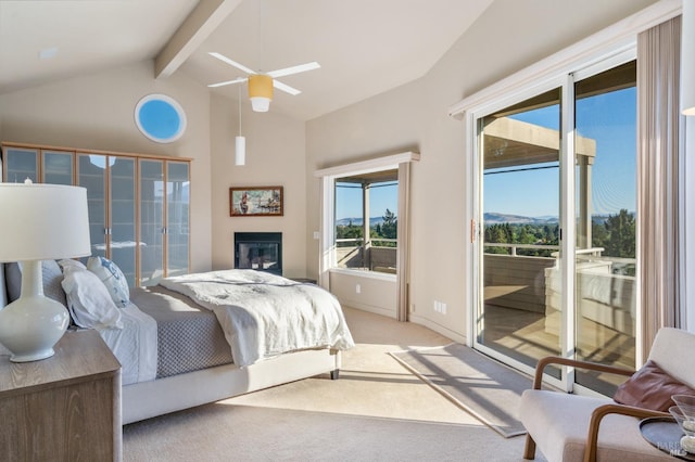 bedroom with lofted ceiling with beams, light colored carpet, access to exterior, baseboards, and a glass covered fireplace