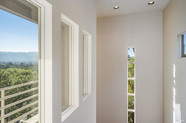 interior space featuring a mountain view and recessed lighting