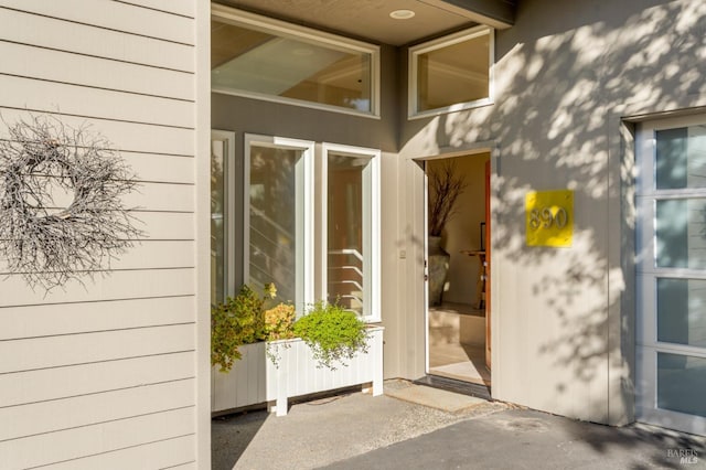 property entrance featuring a patio