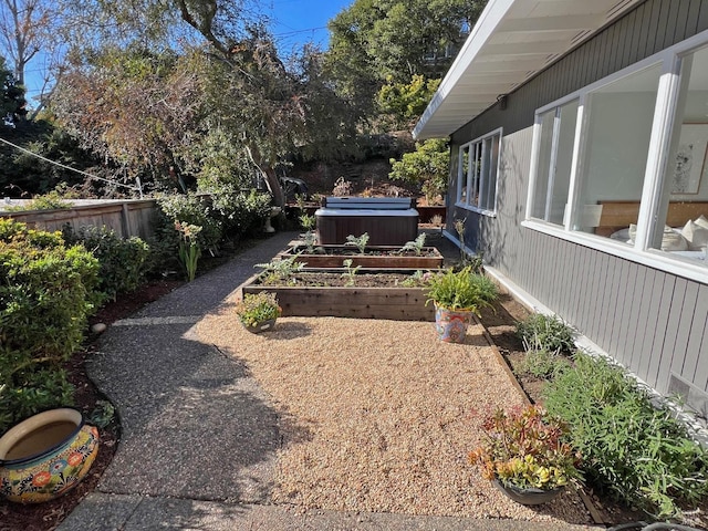 view of yard with a hot tub