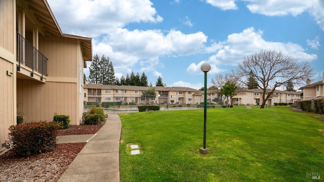 view of community featuring a lawn