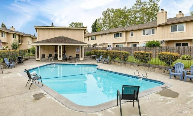 view of swimming pool with a patio