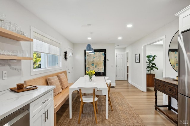 dining area with light hardwood / wood-style flooring