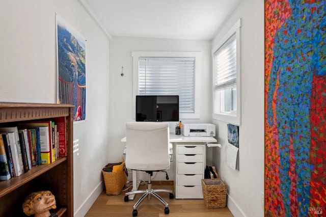 office space with light hardwood / wood-style floors