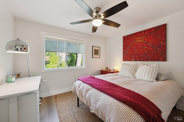 bedroom featuring ceiling fan and hardwood / wood-style floors