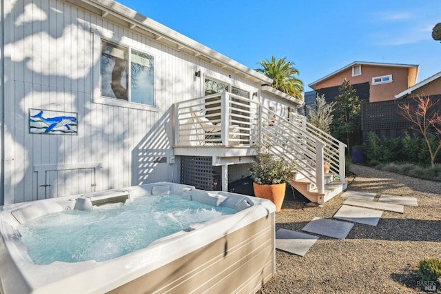 exterior space with a hot tub