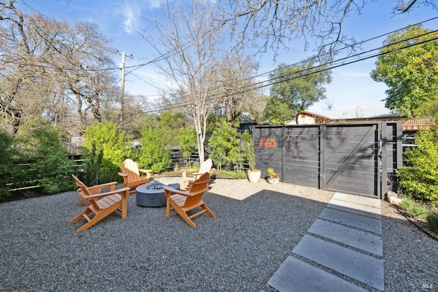 view of yard with an outdoor fire pit