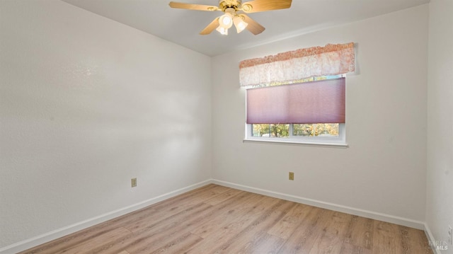 unfurnished room featuring light wood-type flooring, ceiling fan, and baseboards