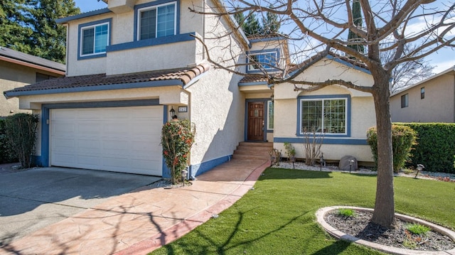 view of front of property featuring a tile roof, stucco siding, concrete driveway, a front yard, and a garage