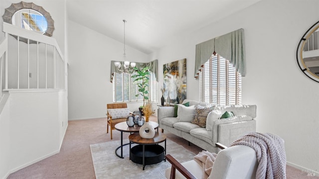 living area with baseboards, high vaulted ceiling, carpet flooring, and an inviting chandelier