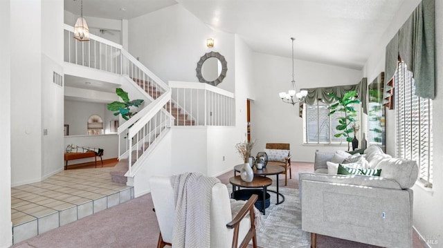 living room featuring high vaulted ceiling, carpet flooring, a notable chandelier, and stairs