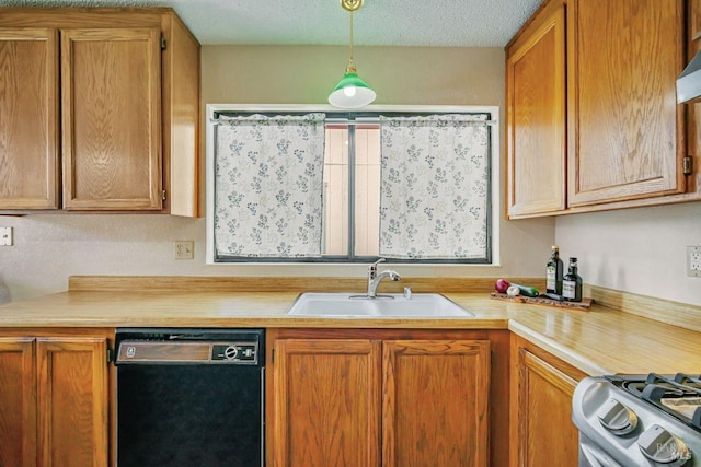 kitchen featuring a sink, stainless steel gas stove, light countertops, and dishwasher