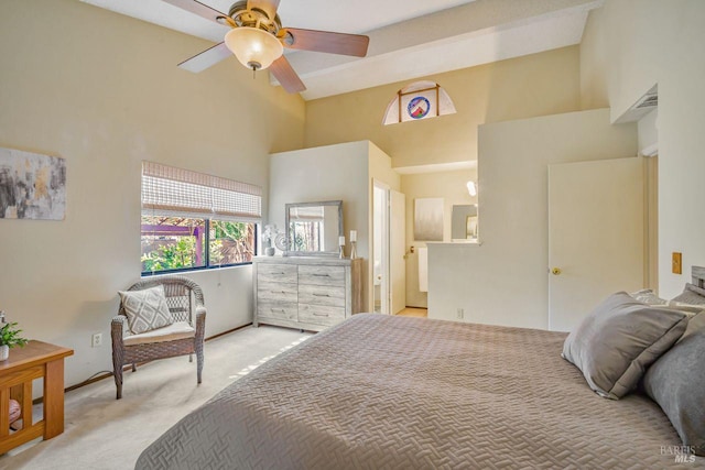 bedroom with light carpet and a towering ceiling