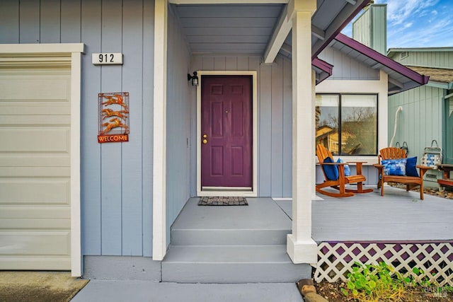 property entrance featuring board and batten siding