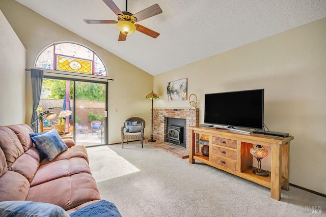 carpeted living area with lofted ceiling, ceiling fan, and a textured ceiling