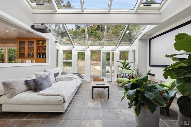 sunroom / solarium featuring a skylight and plenty of natural light