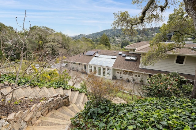 birds eye view of property with a mountain view