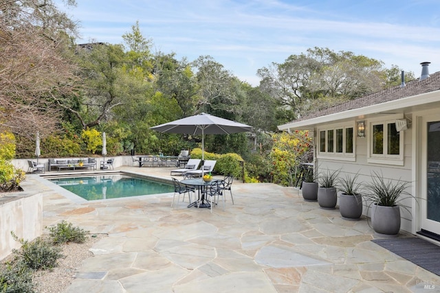 view of pool featuring a fenced in pool and a patio