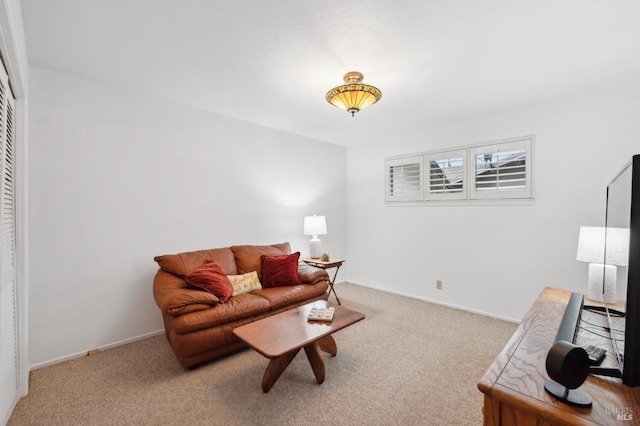 living room featuring light carpet and baseboards