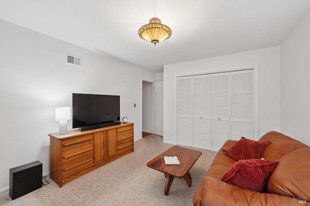 living area with light carpet and visible vents