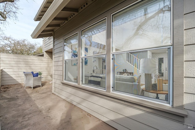 view of side of property with a patio