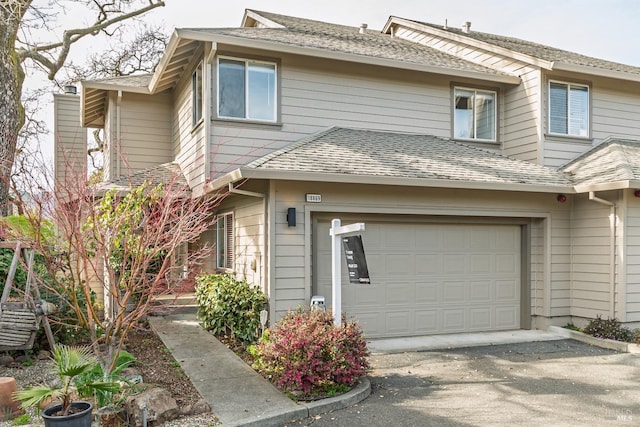 view of front of property with a garage