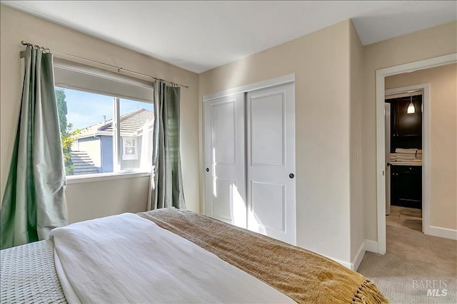 carpeted bedroom with a closet