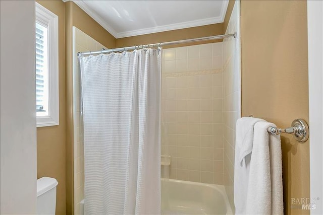 bathroom featuring ornamental molding, shower / bathtub combination with curtain, and toilet
