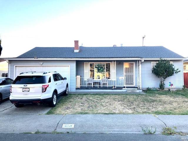 single story home with a garage and a porch