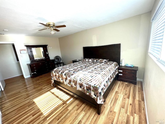 bedroom featuring hardwood / wood-style flooring and ceiling fan