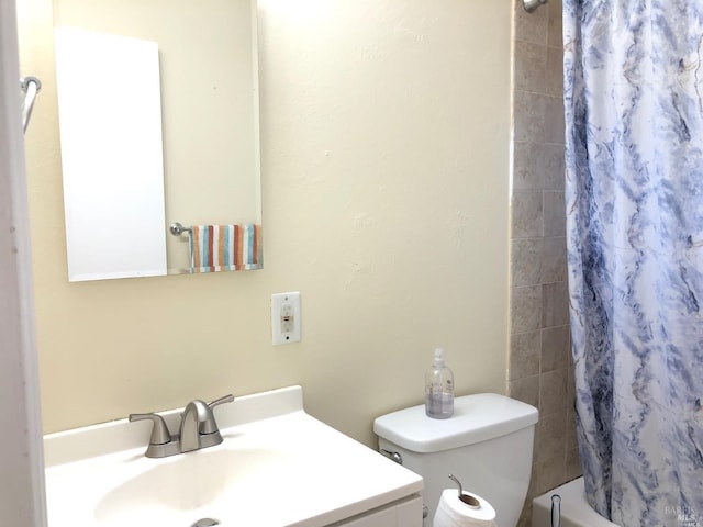 full bathroom featuring toilet, vanity, and shower / bath combo with shower curtain