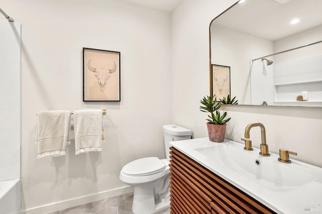 bathroom with vanity, toilet, and tile patterned floors