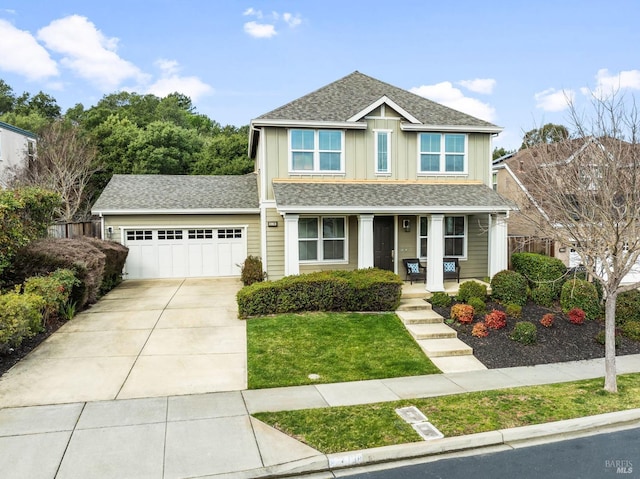 view of front of house featuring concrete driveway, board and batten siding, a front lawn, a porch, and a garage
