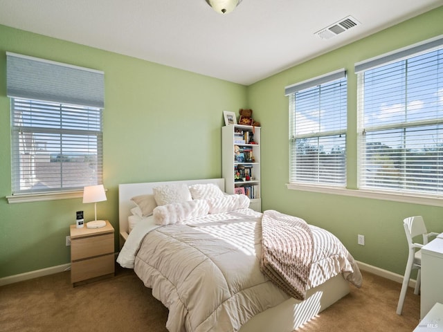 bedroom featuring carpet, visible vents, and baseboards