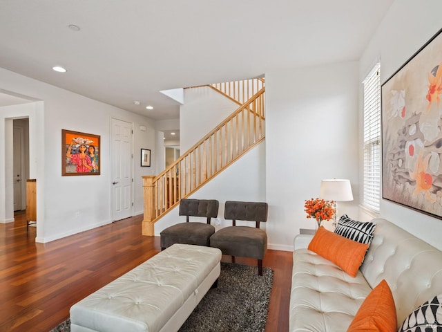 living area with recessed lighting, dark wood finished floors, stairway, and baseboards