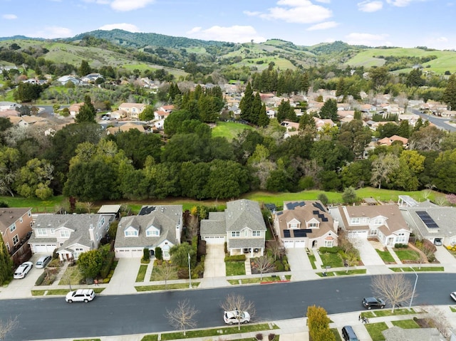 drone / aerial view featuring a residential view and a mountain view