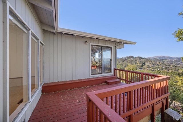 wooden deck featuring a mountain view