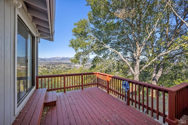 wooden terrace with a mountain view