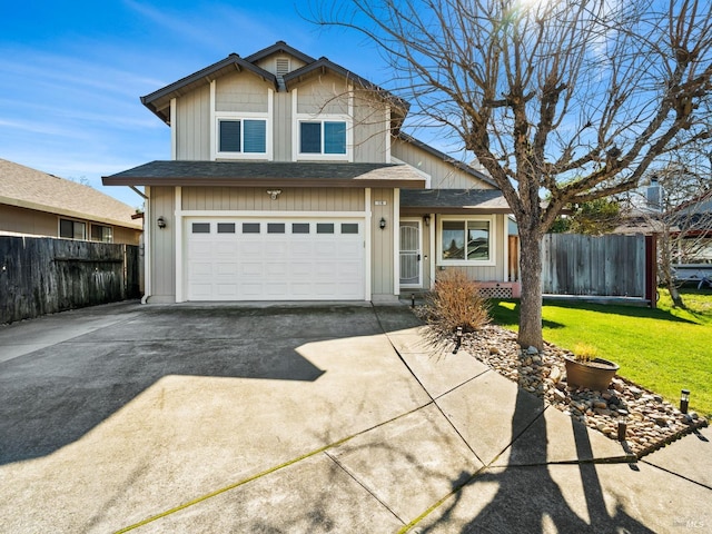 traditional-style house featuring driveway, a front lawn, roof with shingles, and fence