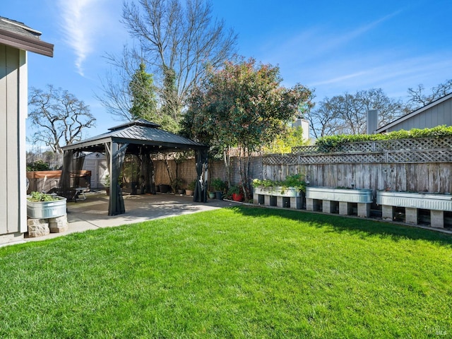 view of yard with a gazebo, a patio area, and a fenced backyard