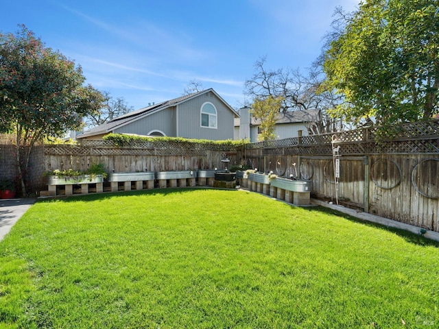 view of yard with a fenced backyard