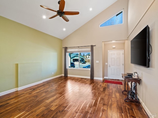 unfurnished living room featuring high vaulted ceiling, recessed lighting, dark wood-style flooring, a ceiling fan, and baseboards