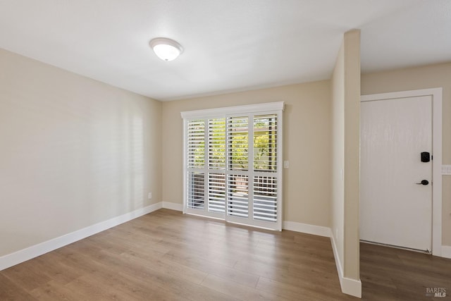 unfurnished room featuring light wood-type flooring