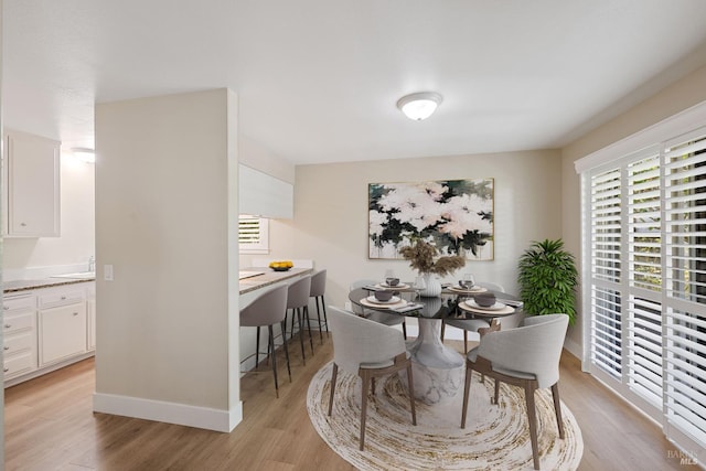 dining room with light wood-type flooring