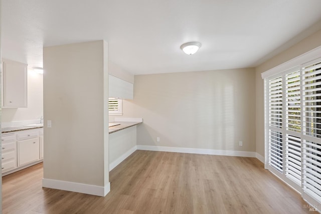 empty room with light hardwood / wood-style floors