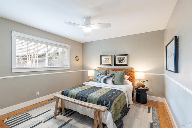 bedroom with hardwood / wood-style flooring and ceiling fan